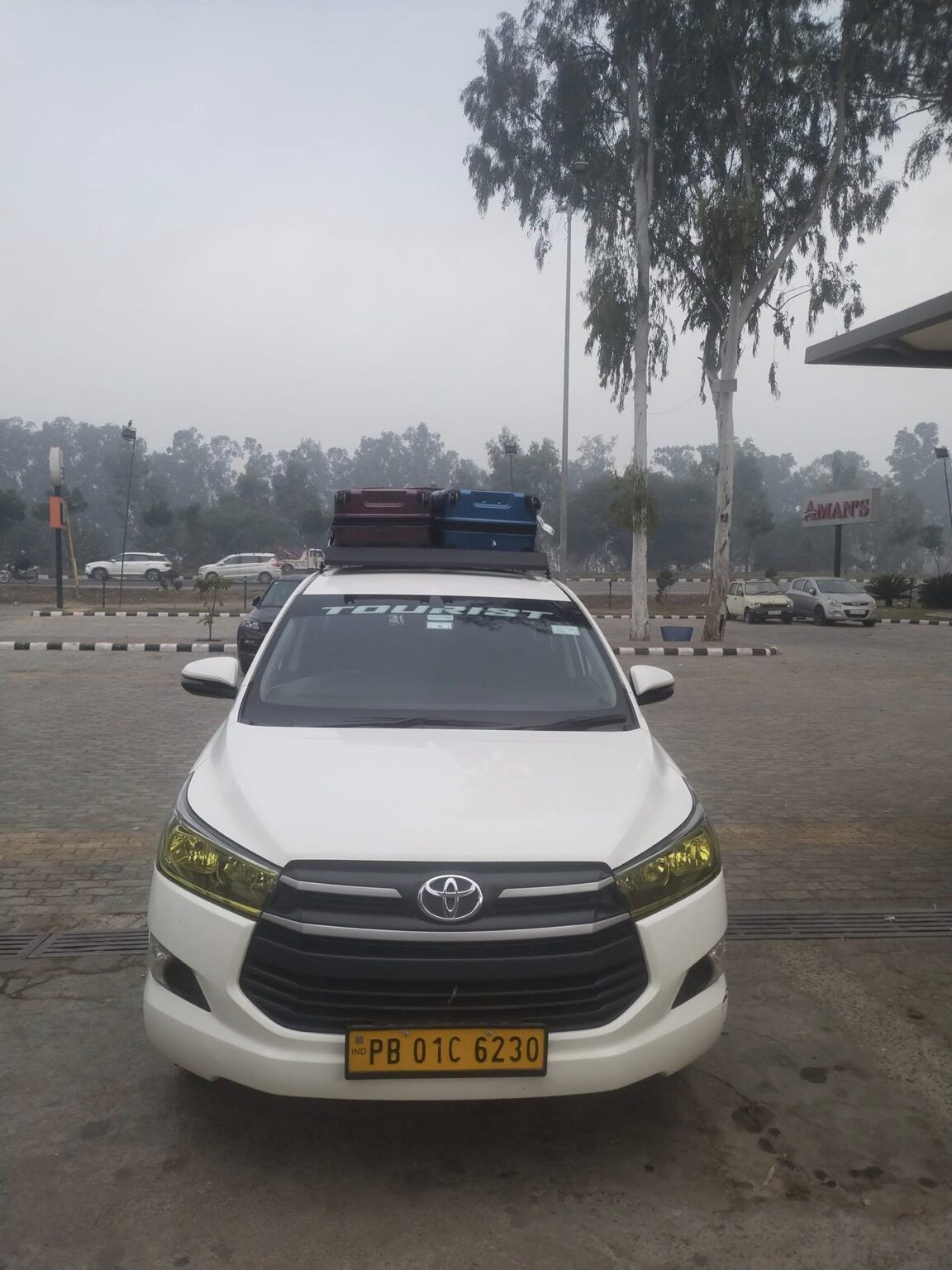 Waheguru Taxi Service Innova Crysta loaded with luggage for an outstation trip from Jalandhar